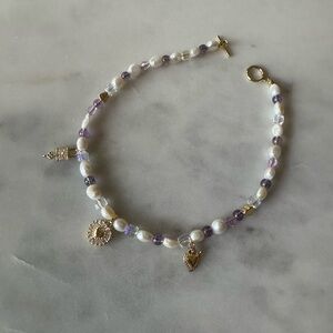 Freshwater pearl charm choker, gold charms